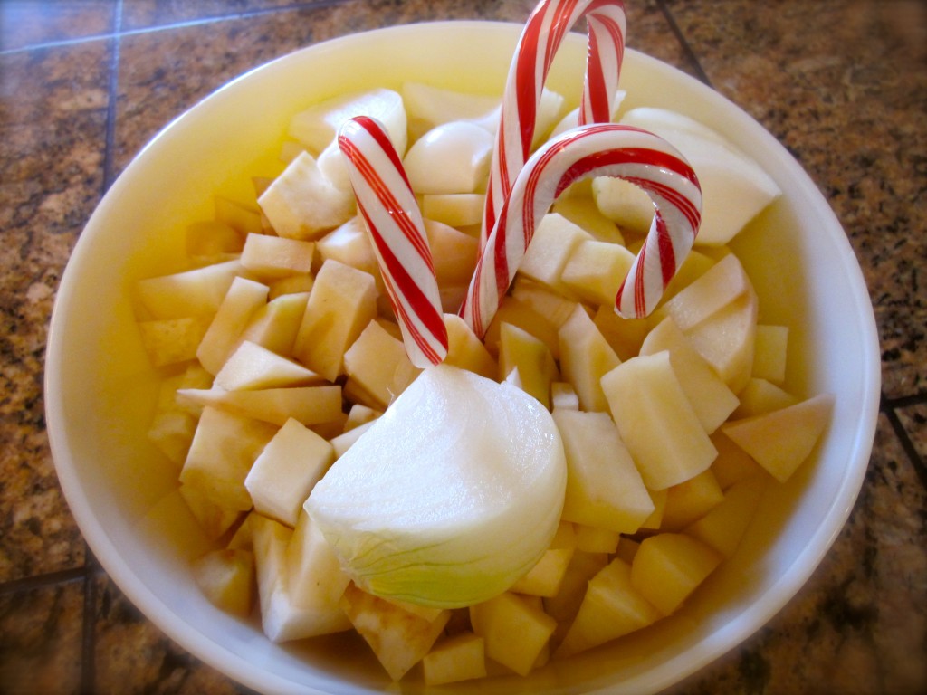 Peel and cut up 2 celery roots and one medium russet potatoes . Quarter an onion. This is ready to be added to a pot of boiling milk, water and salt. To avoid a strong peppermint flavoring, discard the candy canes.