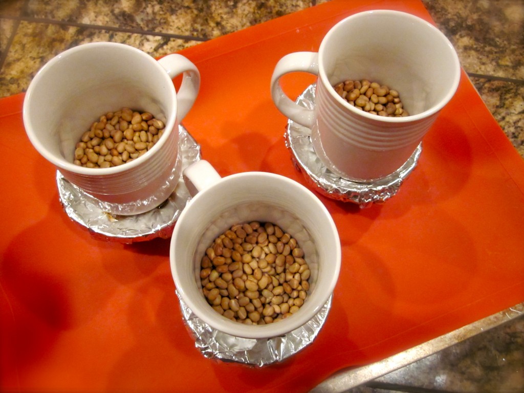 After wrapping each ramekin in parchment paper and then foil, I pierced each ramekin, making 4 air holes. Each had to also be weighted down before placing in the oven at 300 degrees. 