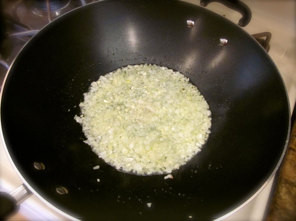 A small, finely chopped onion is the first ingredient for the heated wok. Cook for only a minute until ir's translucent.