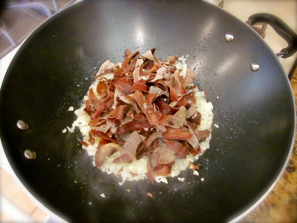 Now it's time for the rehydrated mushrooms and garlic. Cook for another 30 seconds.