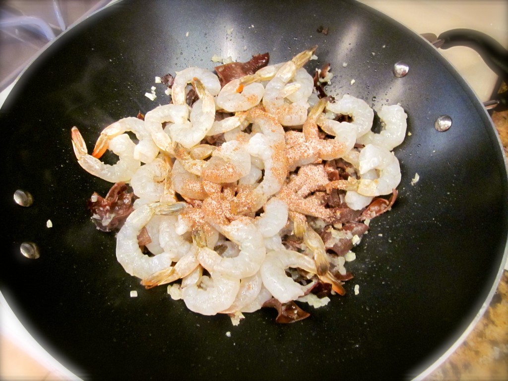 After the shrimp is added, quickly add the spice mixture and season with salt and pepper. After 30 seconds, dump in 2 cups of tomato puree (not pictured). All this is accomplished in 3-4 minutes. Do you see why wokking makes me nervous? I need some thinking time!