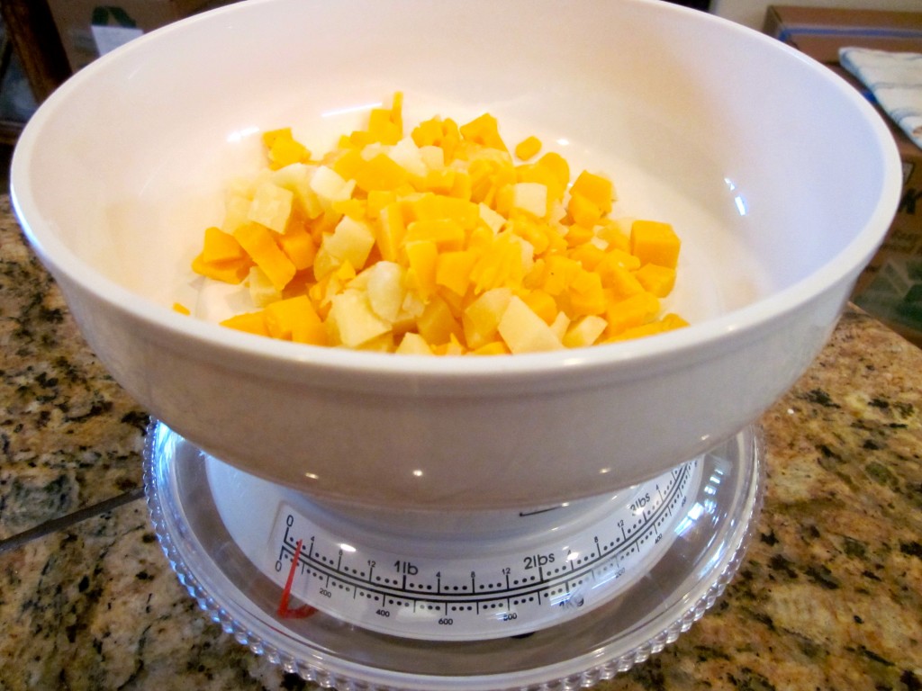 Dorie suggests using 3 ounces of tiny cubed cheese bits for the custard mixture and 2 ounces of grated cheese for the topping. To get it right, I weighed my portions and find that I'm using my scales more often these days. 