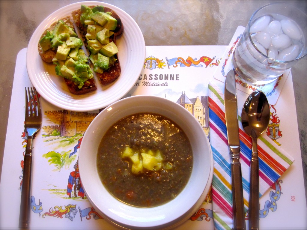 Orange-scented Lentil Soup garnished with a dollop of Greek yogurt and fresh pineapple bits