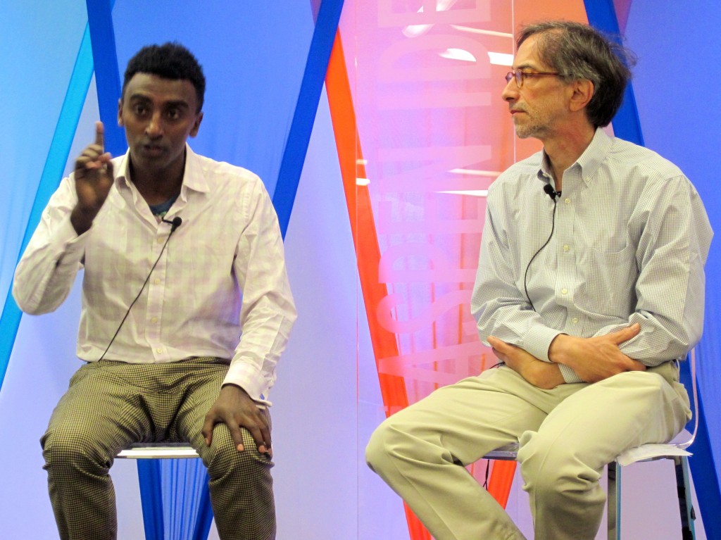 Chef Marcus Samuelsson taling with food writer Corby Kummer at the Aspen Institute's Ideas Festival 2013