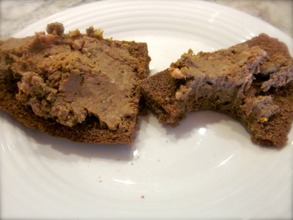 The chicken liver mixture spread on pumpernickel rye bread