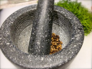 Crush toasted peppercorns, white and black, and coriander seeds with a mortar & pestle