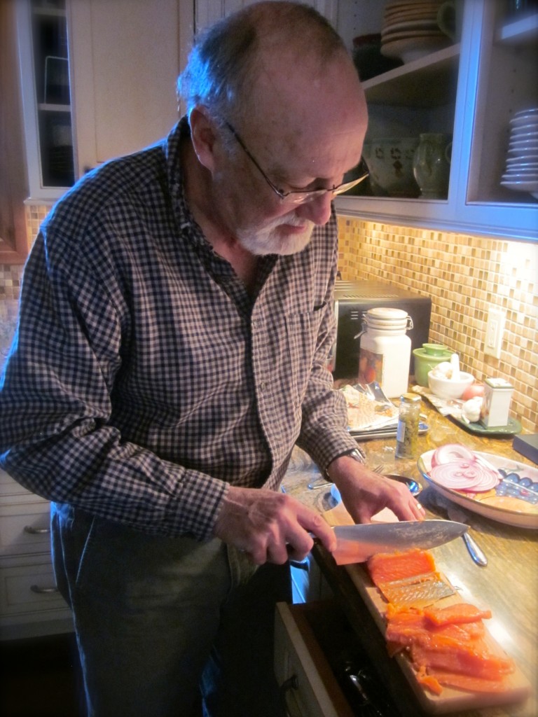 Bernie thinly slices the salmon, cutting on the diagonal, leaving the skin behind. (Please know that Donna and I are standing close behind giving Bernie directions!)