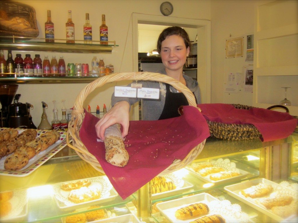 Emptying Sarah's baguette basket at Hoppe's Bakery. (Sarah has applied to Colorado University's doctoral program in political science and is nervously waiting to hear from Boulder.) 