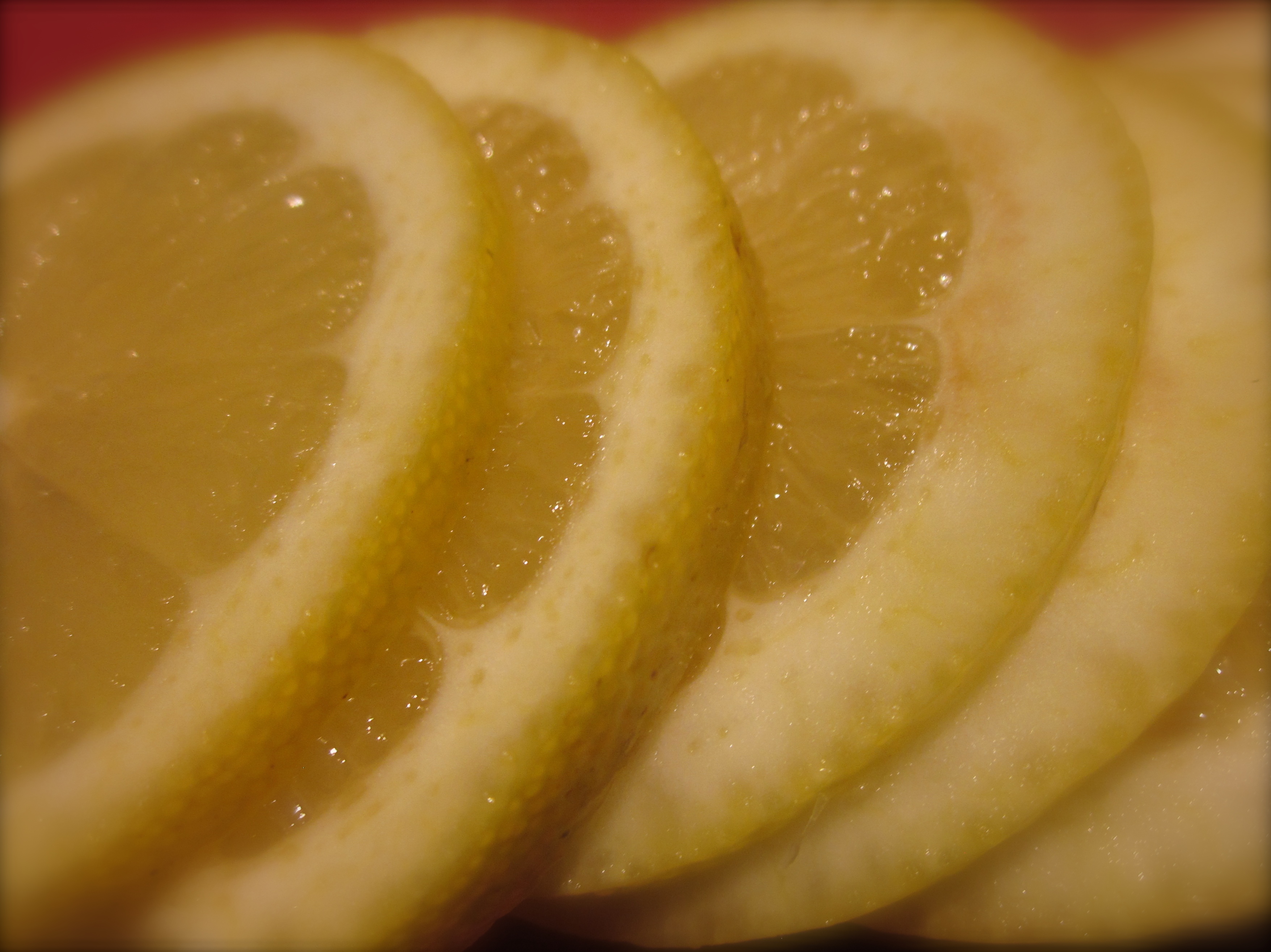 To prepare the preserved lemons, first slice.