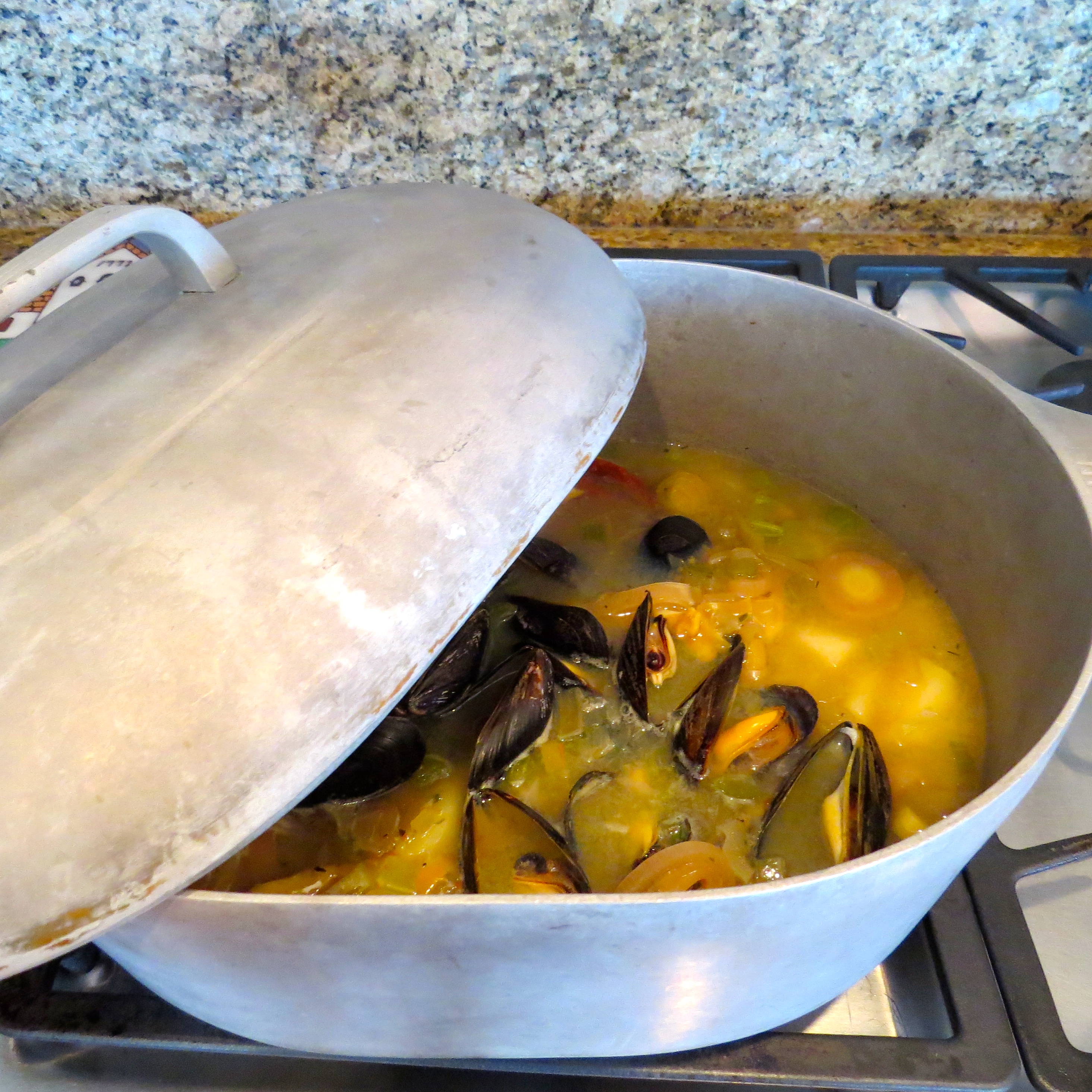 It is traditional with this dish, which Dorie calls Simplest Breton Fish Soup, to bring the kettle to the table and ladle the soup into bowls which have a toasted baguette slice already at the bottom.  
