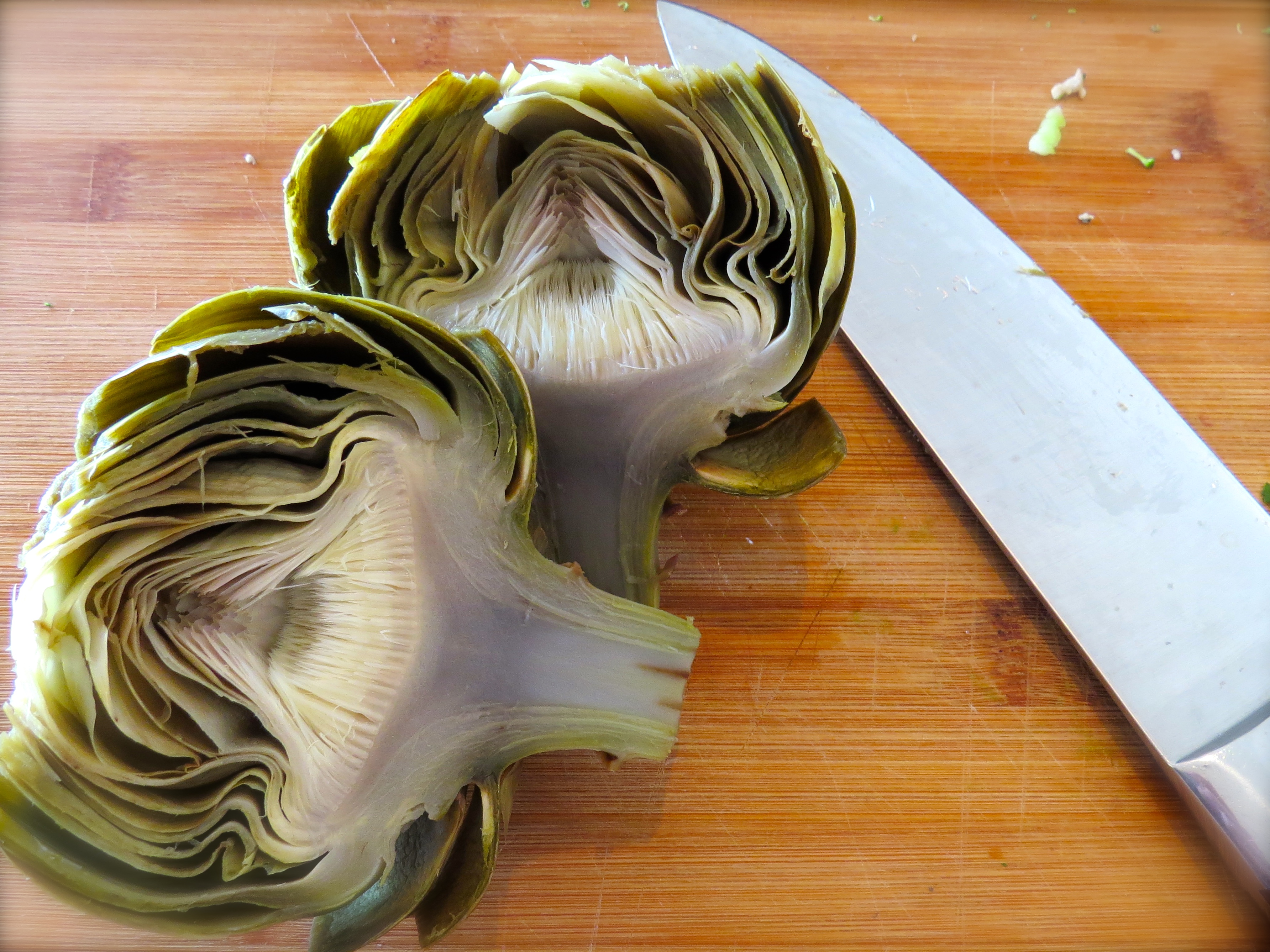 After I sliced the steamed artichoke in two, I needed to scrape out the choke (the fuzzy center.)