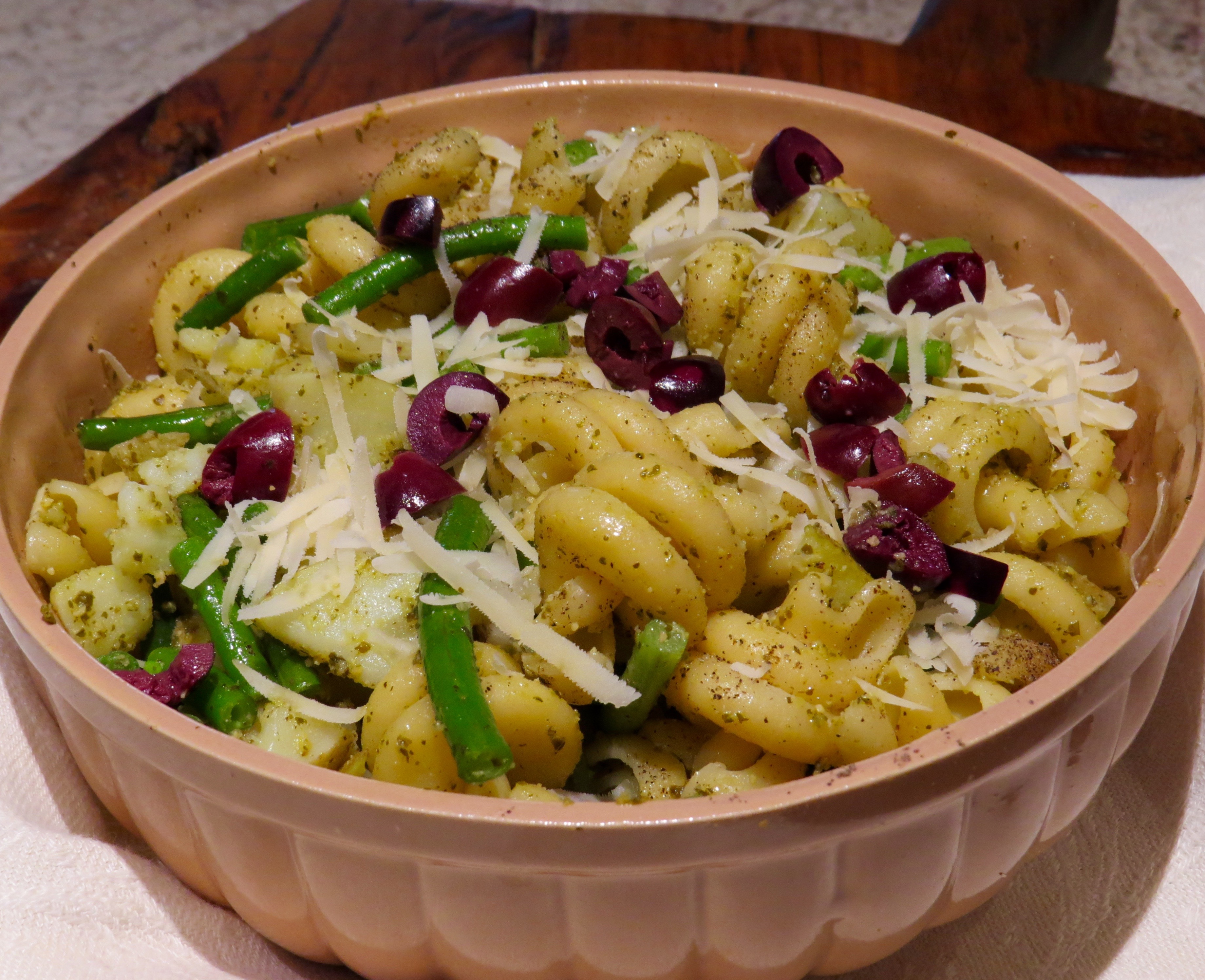Pasta with new potatoes, green beans, and pesto, served steaming hot or room temperature.