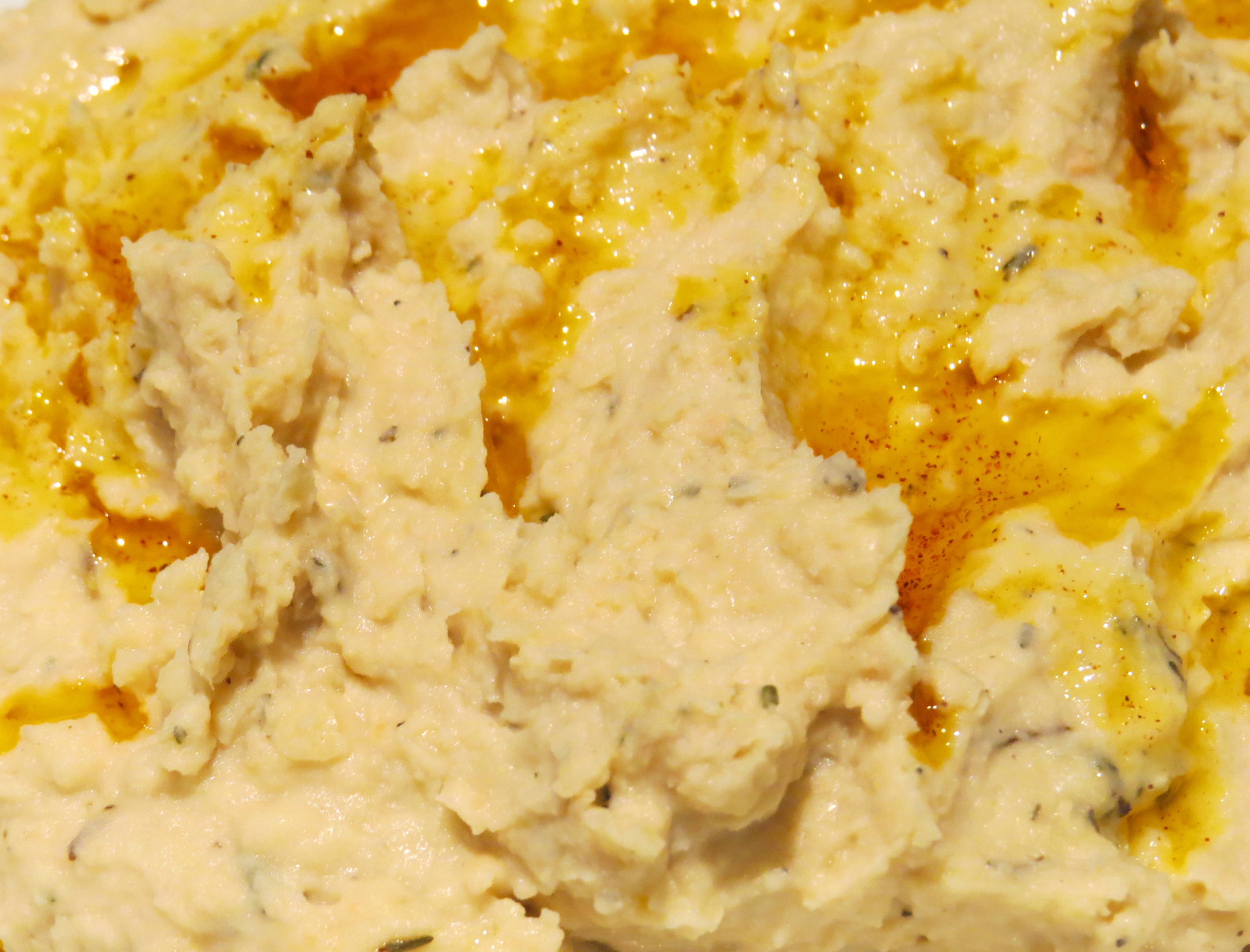 Cannellini Bean Hummus topped with Olive Oil infused with Smoked Paprika 