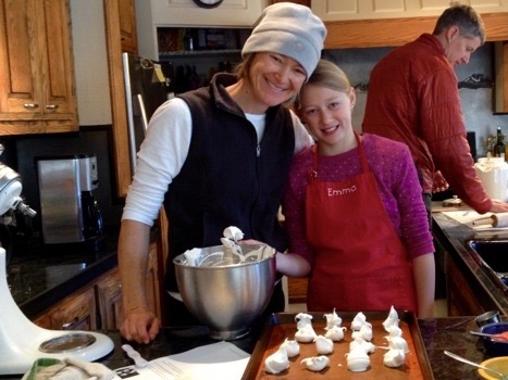 Emma's making meringues with her Mom while her Dad makes breakfast.