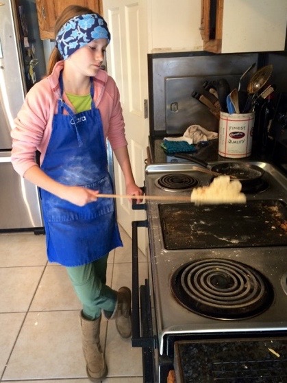Clara (and, her Dad) are the designated Lefse griddle bakers. Lefse is a traditional soft, Norwegian flatbread made with leftover potatoes, flour, butter, and milk or cream.