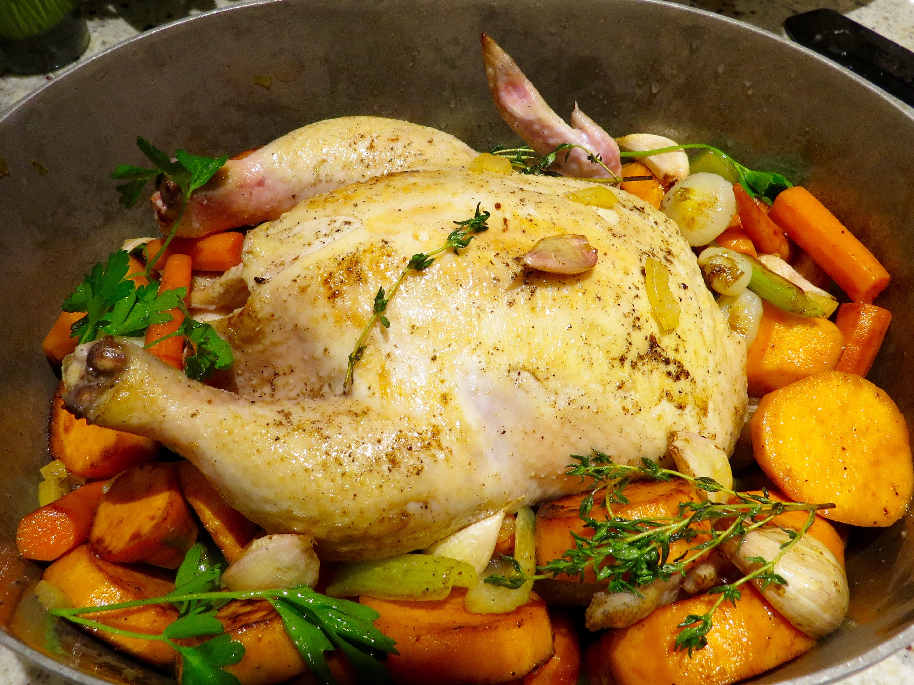 After the chicken is browned on all sides, it joins its veggie friends for a roast in the oven.