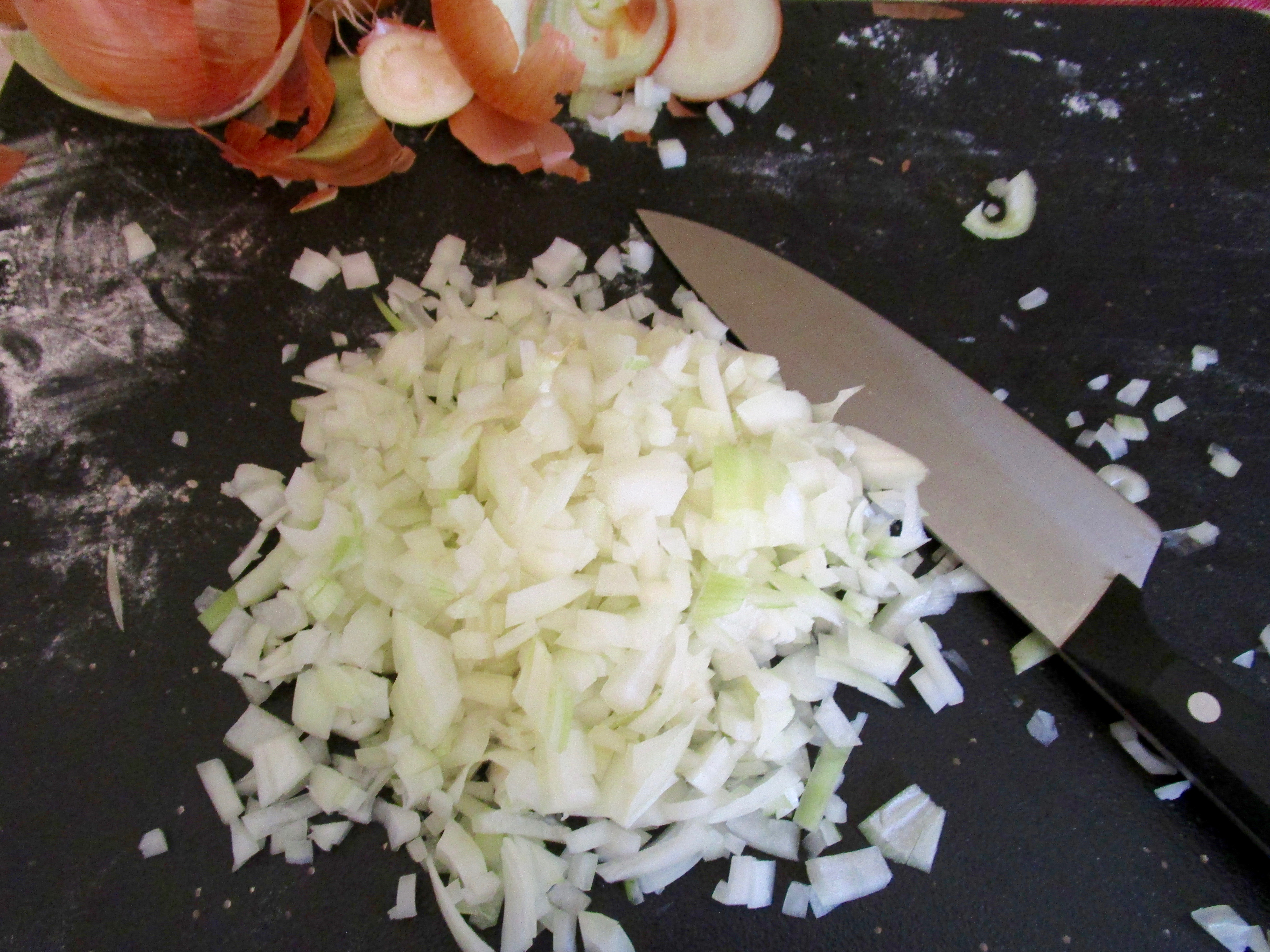 Every great stew needs onions in abundance. Peel. Slice. Dice.