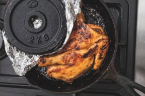 David used a leftover weight to weigh down his chicken while browning it on top of the stove. 