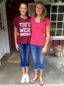 CLARA, 13, (L) and EMMA, 15, DURING the SUMMER. 